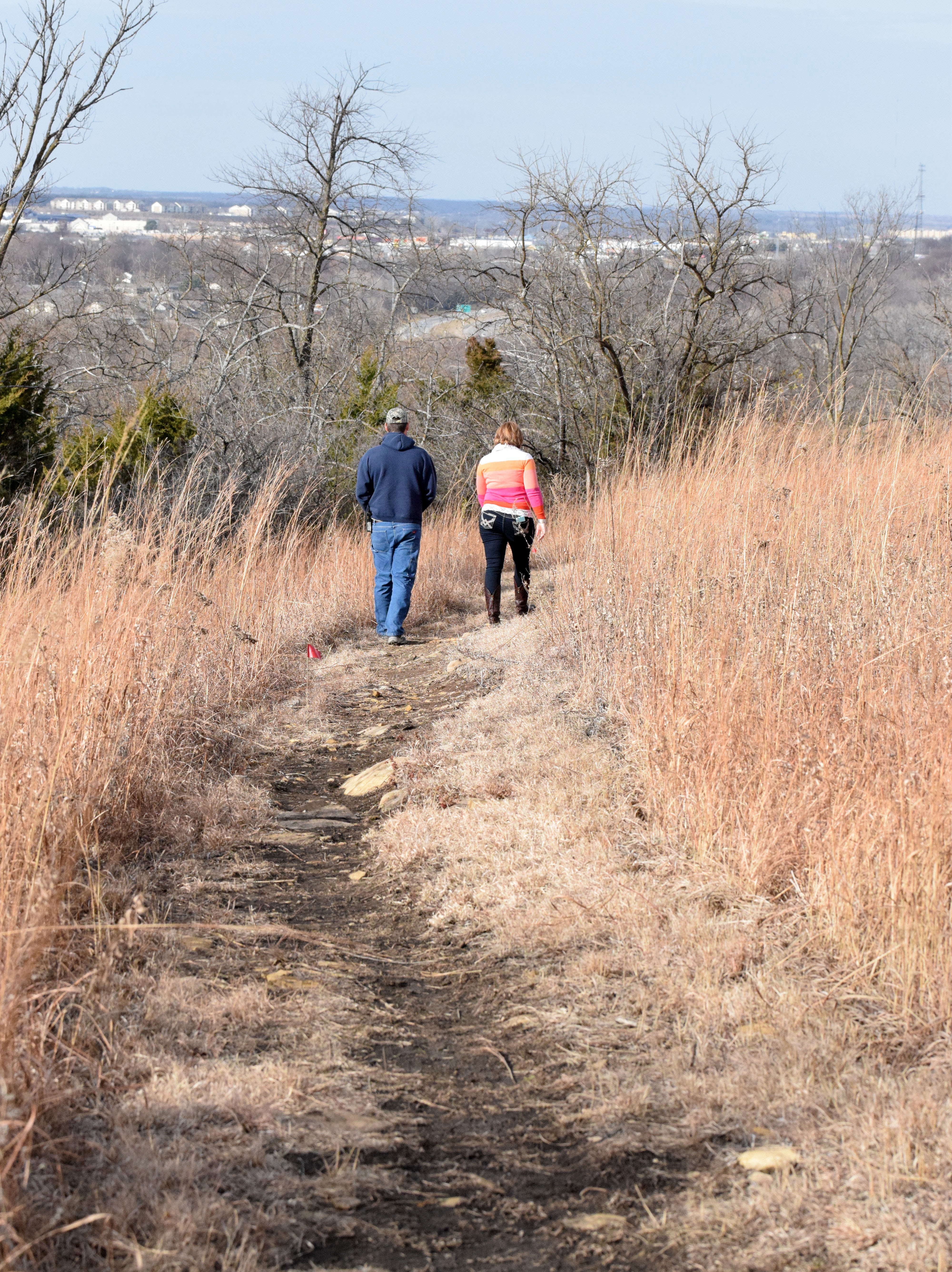Walkers on trail downhill 2 t